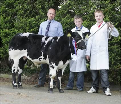 Winners of the champion 4-6 month Calf and reserve Male Oliver McGuiness with Liam and Chrisopher McGuniness and Jason Edgar representing Donnelly Group Dungannon