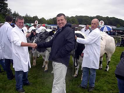 Snowy Ridge 1st Place Pairs being congratulated by judge Mr Rhys Jenkins